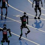 WATCH: Robots sprint and play football at first world games in Beijing