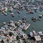 At least four killed and several trapped in flash flooding in northern India, officials say