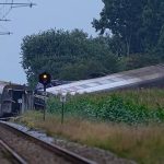 At least one person killed after train collides with tanker in Denmark, local officials say