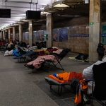 Kyiv residents shelter in metro stations as Russian air strikes resume
