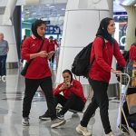 Iranian women’s football team seen at Malaysian airport as they prepare to head home