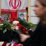 People lay flowers at makeshift Khamenei memorial in Moscow