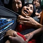 Harrowing image of children clinging to detained father named World Press Photo of the Year