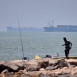 UK maritime agency raises Strait of Hormuz threat level after oil tanker reports being struck