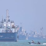 Cargo ship hit by projectile in Hormuz as Iran issues renewed passage warning