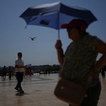 Hospitals struggle as European heatwave moves east