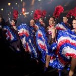 Moulin Rouge dancers welcome Tour de France finale in Paris