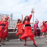 Hundreds dressed in red recreate Kate Bush’s Wuthering Heights dance