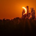 Hikers in awe as solar eclipse turns sky red over French Pyrenees