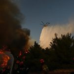 People evacuated from beach as wildfire tears through popular Greek tourist hotspot