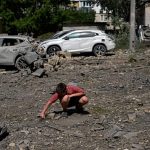 Kyiv residents search through the wreckage after Russia’s deadly barrage