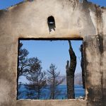 Firefighters scramble to contain fires outside Athens before high winds return