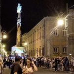 Italian town carries towering Virgin Mary structure through streets