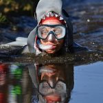 Mud, flippers and snorkels: Wales celebrates 40 years of bog racing
