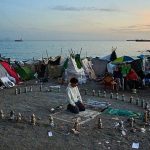 Spanish police remove over 3,000 migrants from Ceuta beach camp