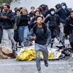 Police clash with protesters in Brussels as thousands march against spending cuts