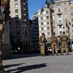 Soldiers patrol Milan streets as shops board up ahead of protests
