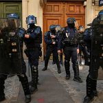 France suspends police stun grenades at student protests after teenager loses hand