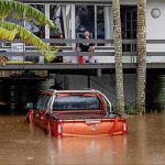 Flash floods swamp southeast Australia as record October rainfall forces school closures