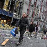 Russian drone attack kills two in Kyiv as residents survey damage
